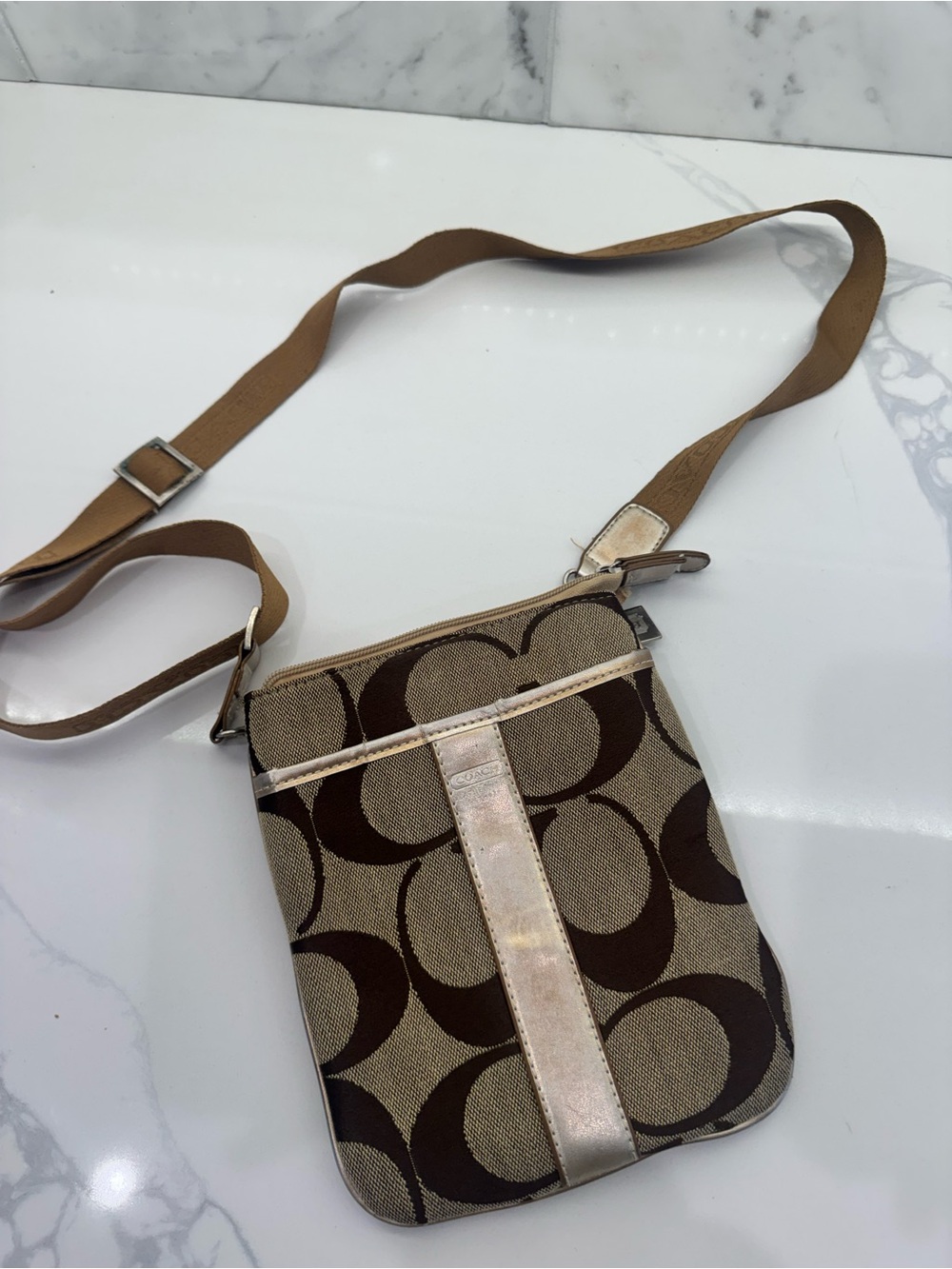 vintage Coach Signature C Jacquard swingpack crossbody bag with a metallic gold